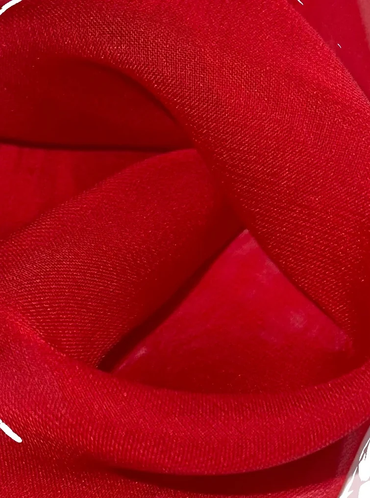 Rolled red textile selected for the Passion project.